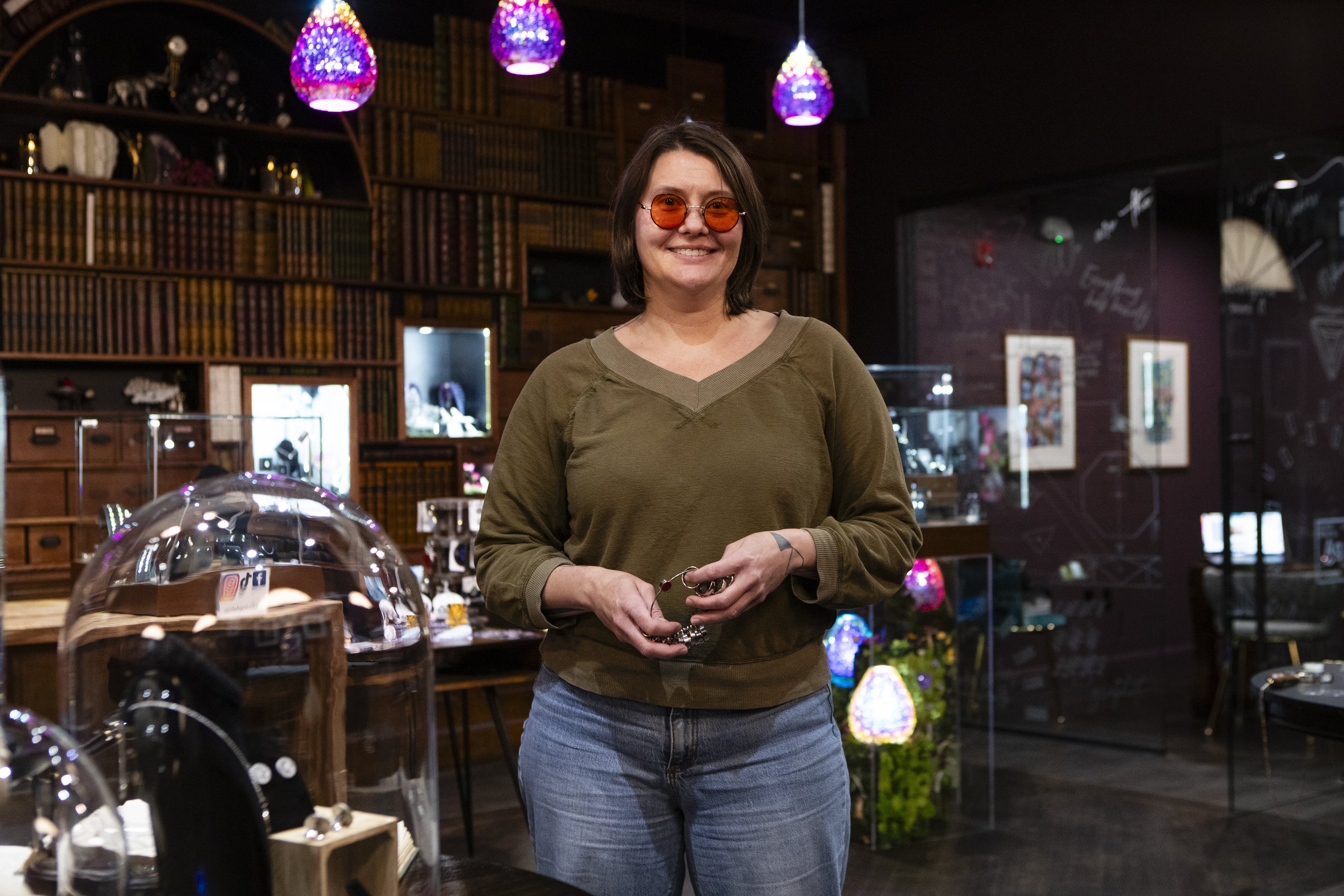A woman stands in a jewelry store