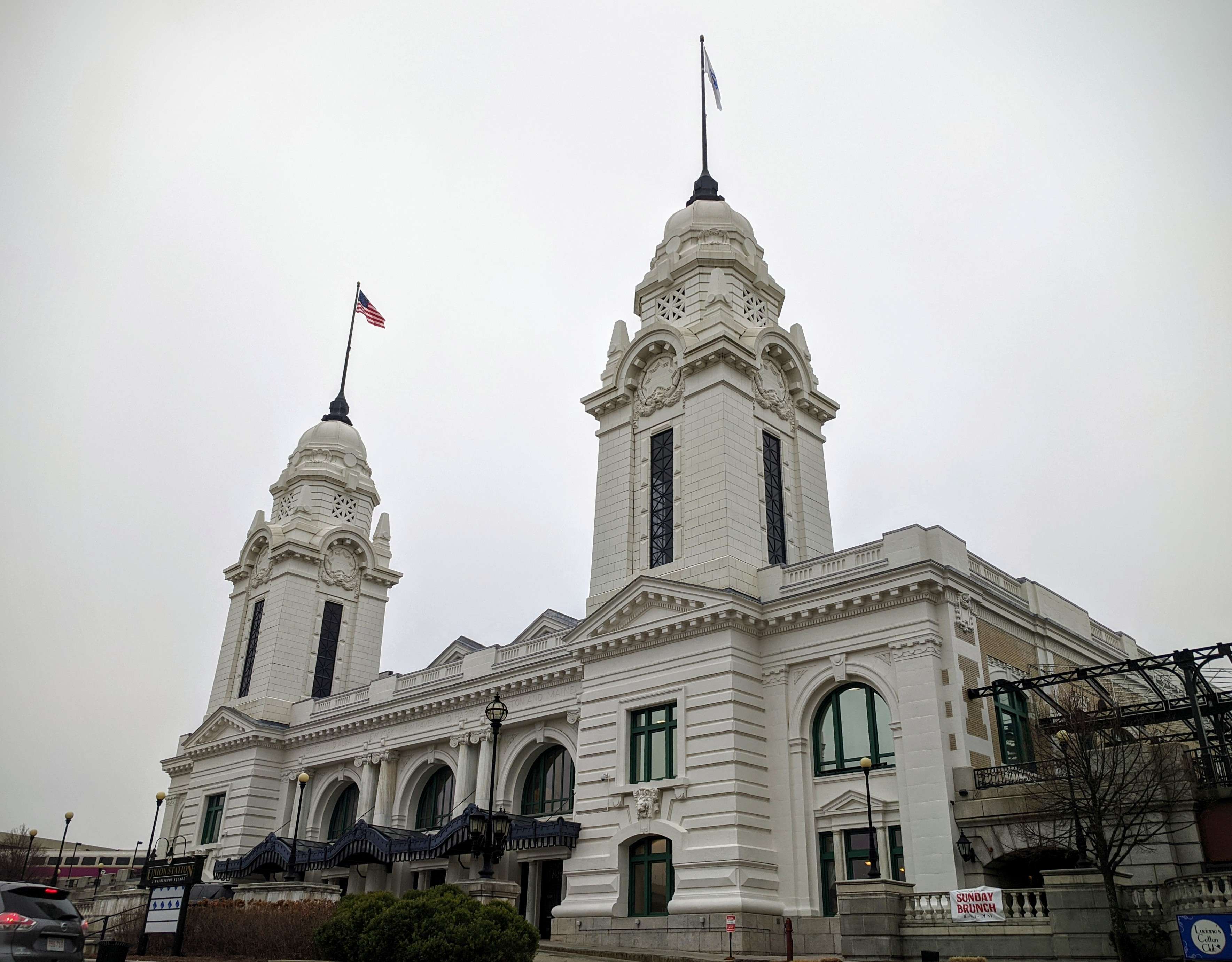 A large white building with two spires. 