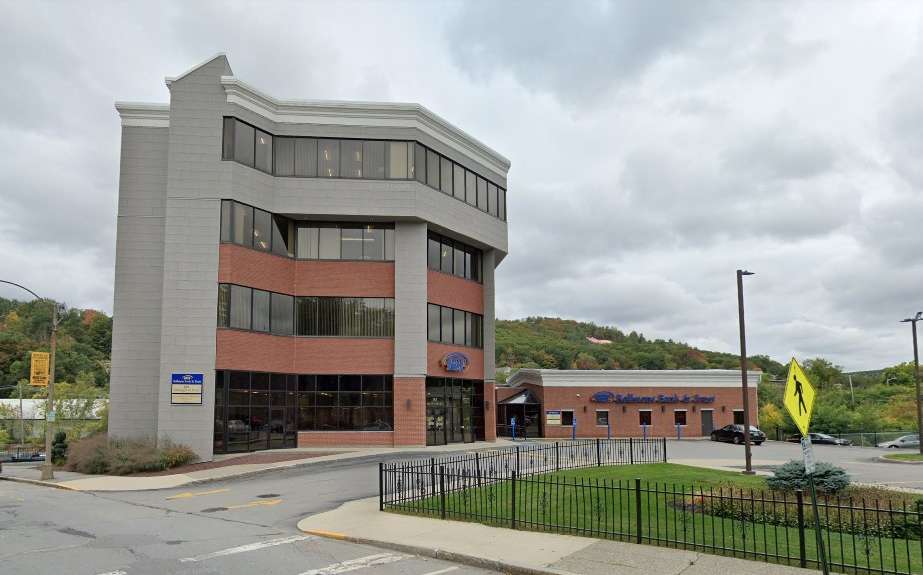 A skinny four-story office building