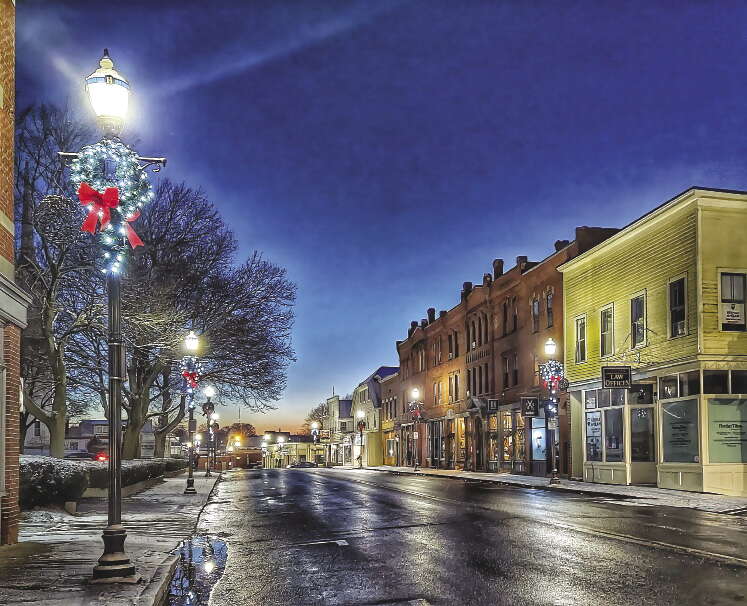 Suburban downtown street at dusk after rain 
