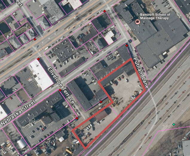 Satellite image of two industrial properties with parcel lines
