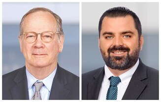 Two headshots side-by-side. The man on the left has grey hair and wears glasses, a grey suit jacket, a light blue button down, and a grey shirt. The  man on the right had dark hair and beard, a dark grey suit jacket, white button down, and a green paterened tie.