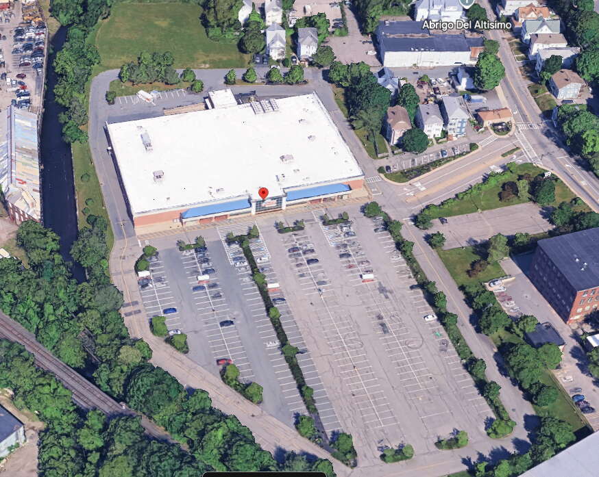 Satellite image of a large grocery store building with a parking lot