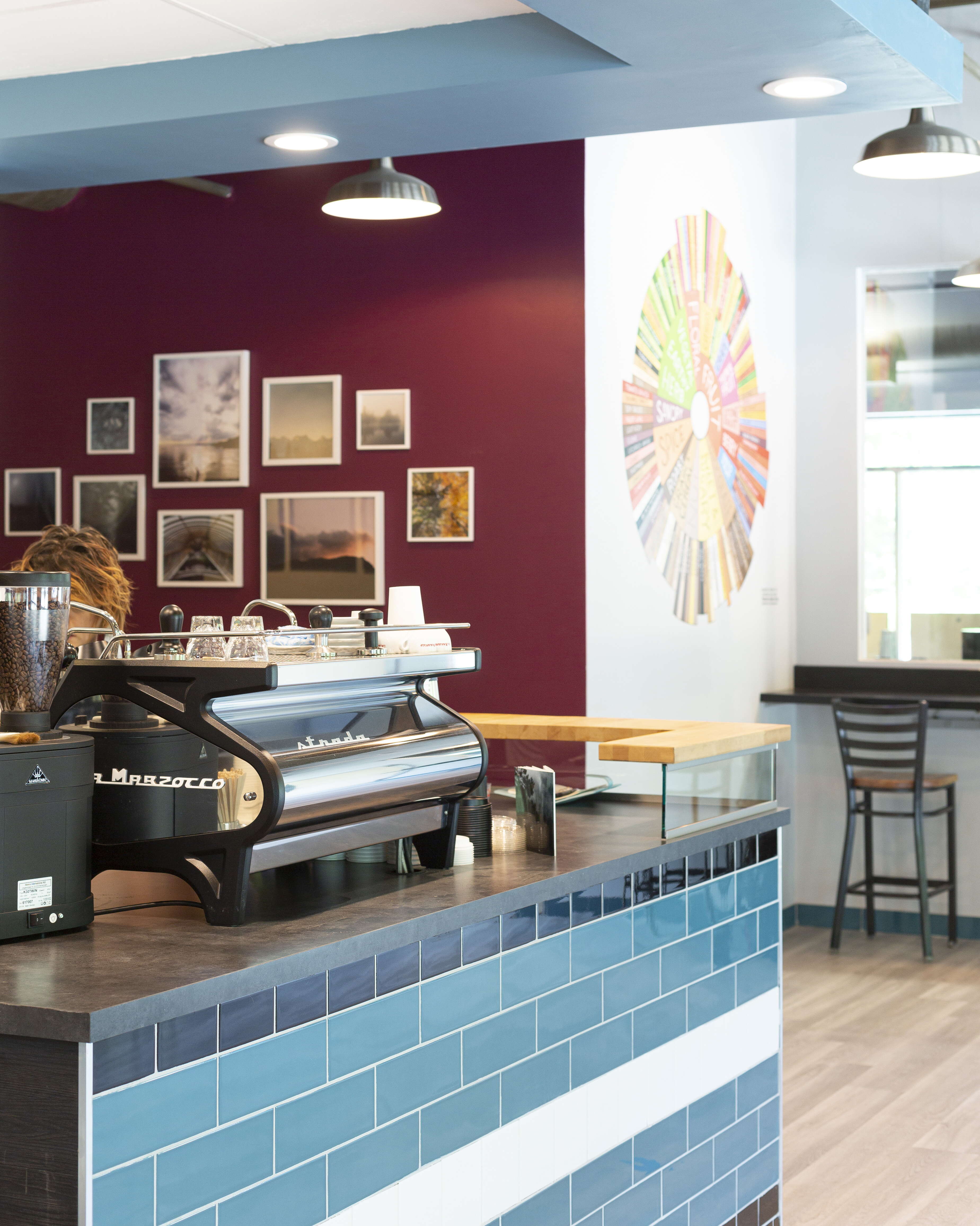 A cafe's counter with coffee machines on it.