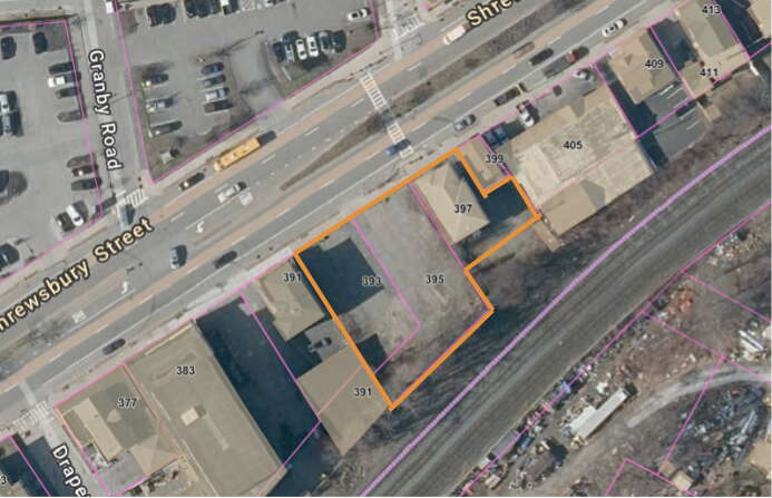 Satellite image of a vacant lot highlighted in orange