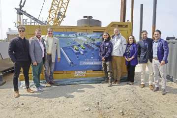 Vineyard Wind official pose before a rendering of an offshore wind farm