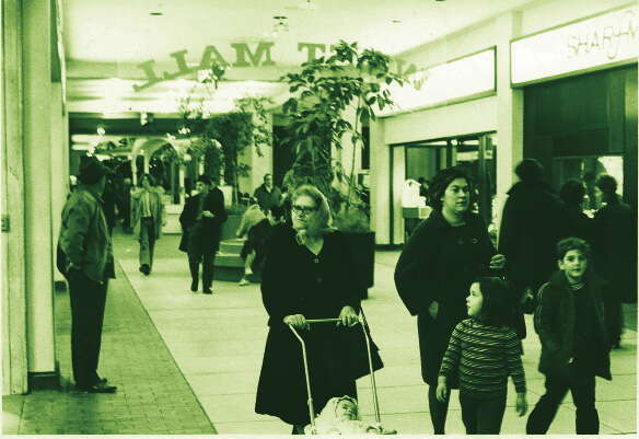 Sepia photo of shoppers in a mall