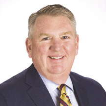 Portrait photo of a man in a suit