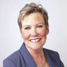 Portrait photo of a woman in a suit