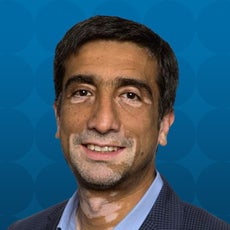 A man in suit poses for profile photo