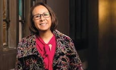 A woman smiles in a photo