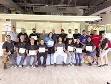 A group of workers standing for a photo