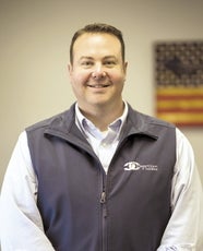 A man in a vest jacket and dress shirt