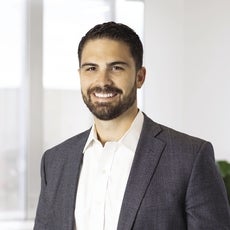 A smiling headshot of Tyson Reynoso