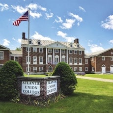A college building with signage in front