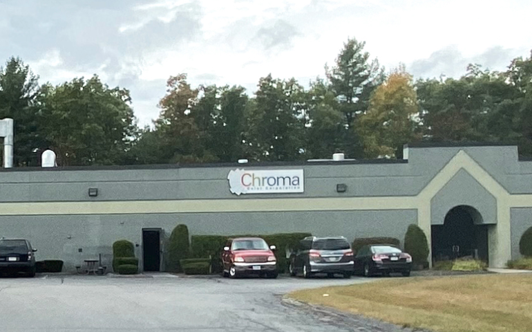 The exterior of a building is shown with a sign reading Chroma Color Corporation 