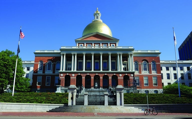 A look at the Massachusetts State House on a sunny day, it's golden dome gleaming in the sunlight. 