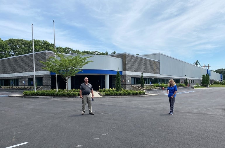 Pictured (from left) are Tegra Medical Director of Manufacturing Brian Rua and Director of Quick Wire and Tubing Patty Rushia in front of 16 Forge Parkway in Franklin  PHOTO: COURTESY OF TEGRA MEDICAL