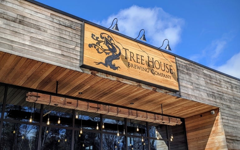 a picture of Tree House Brewery's signage on the front of their Charlton location.