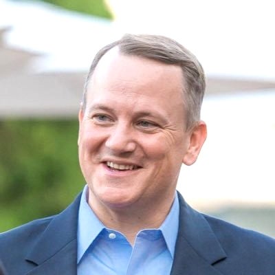 A man smiles