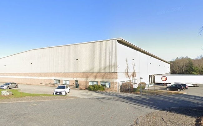 Photo of large beige warehouse building