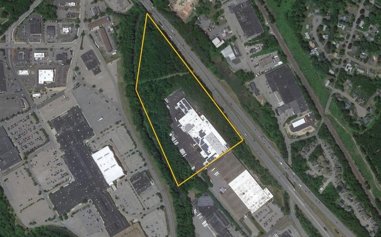 A satellite view of a large property bounded by yellow lines
