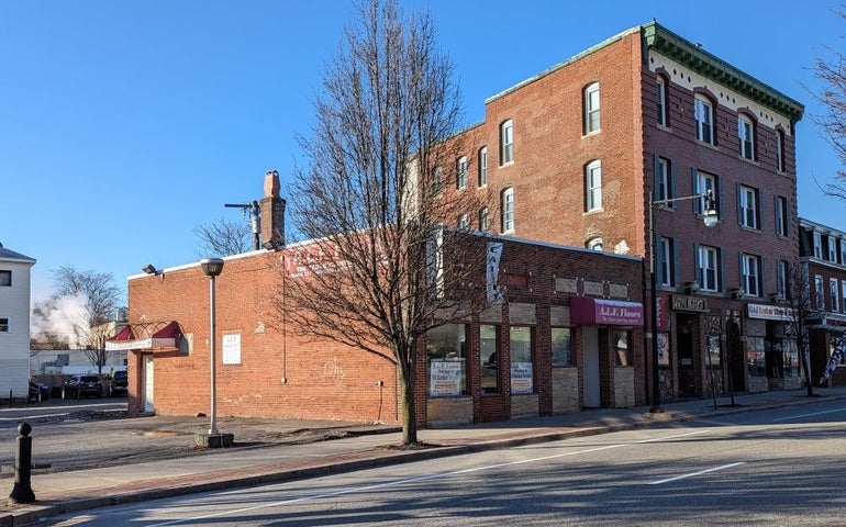 A brick building on a corner lot