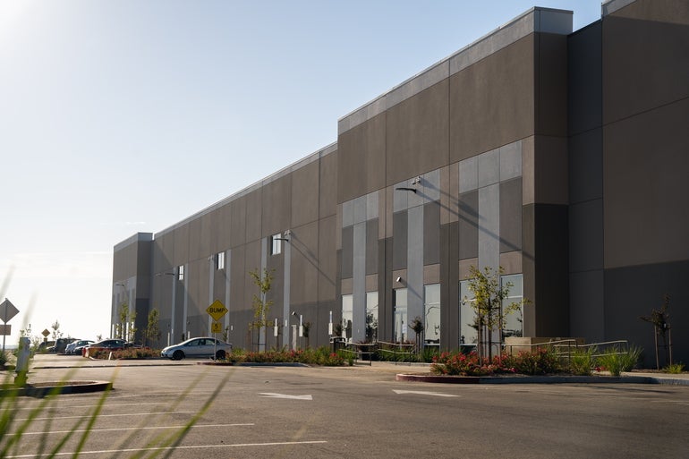 A large grey warehouse building