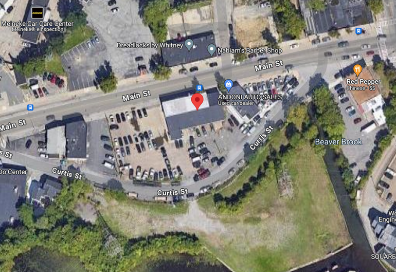 A satellite image of a car dealership and surrounding buildings