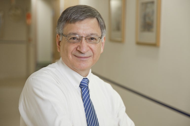 A man in a tie and glasses