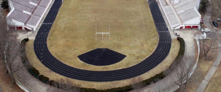 A football field with a running track around it
