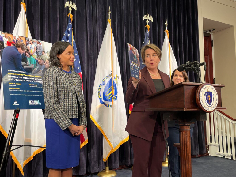 A woman speaks at a podium