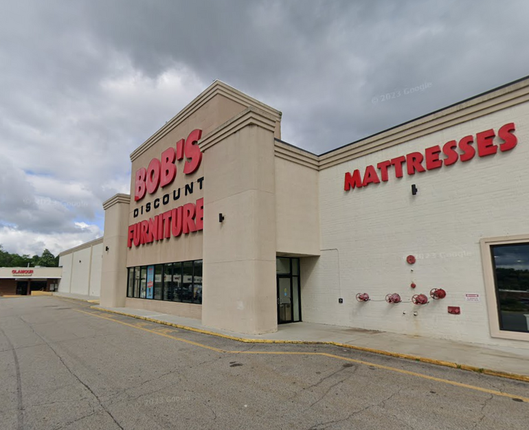 a large retail store in a shopping plaza