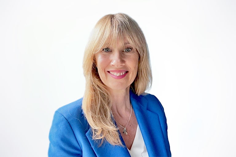 a woman in a blue suit jacket
