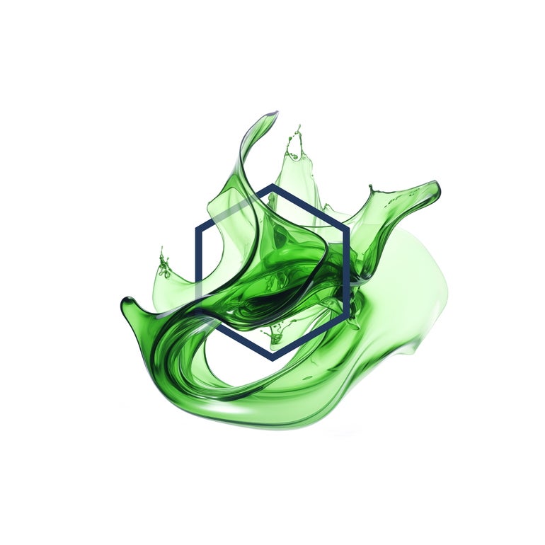 An image of splashed green liquid with the shape of a hexagon within it.