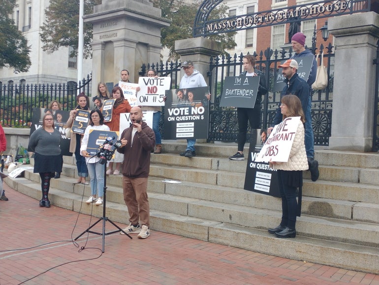 A group of protesters on the state House steps