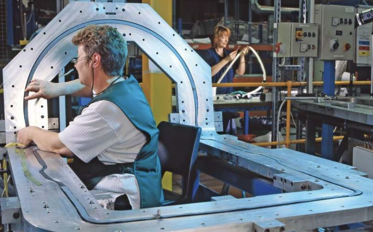 Two women work in a warehouse