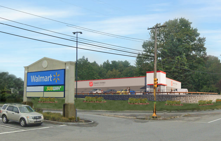 Rendering of a retail store behind a short retaining wall at the entrance of a shopping plaza