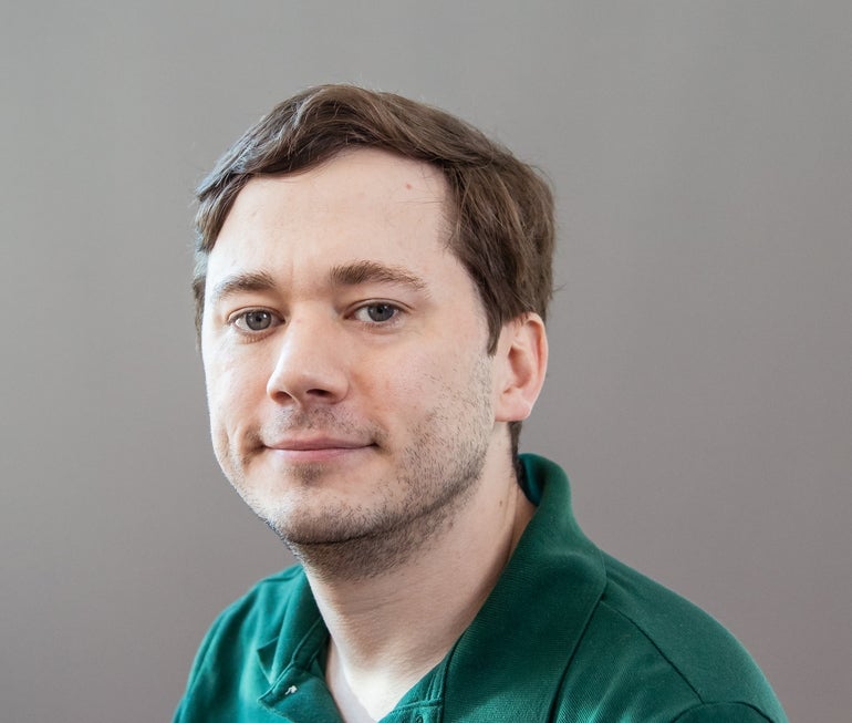 A man in a green shirt