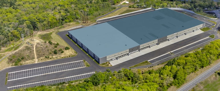 A rendering of a large industrial distribution center viewed from above