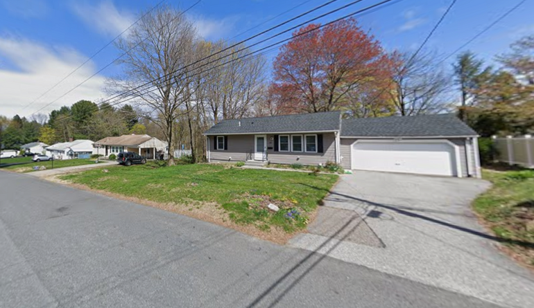 A row of one-story, single-family homes along a suburban street