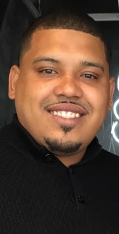 A man wears a black shirt.