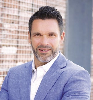 Man in blue suit and white dress shirt