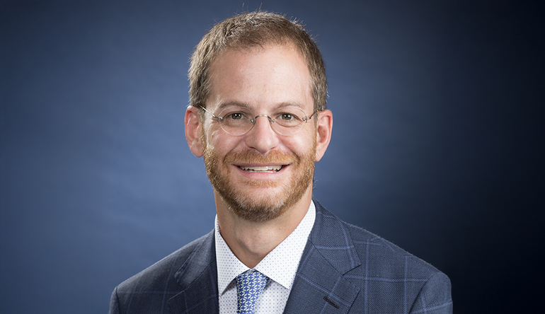 Man in suit with glasses