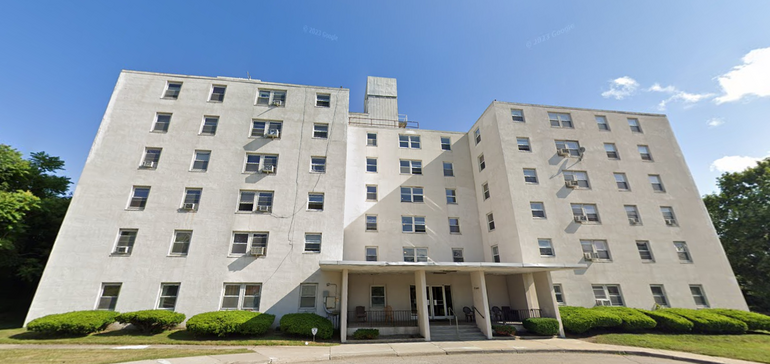 Six-story white apartment building