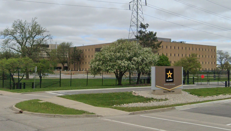 The exterior of a military facility, with a fence and sign for the U.S. Army