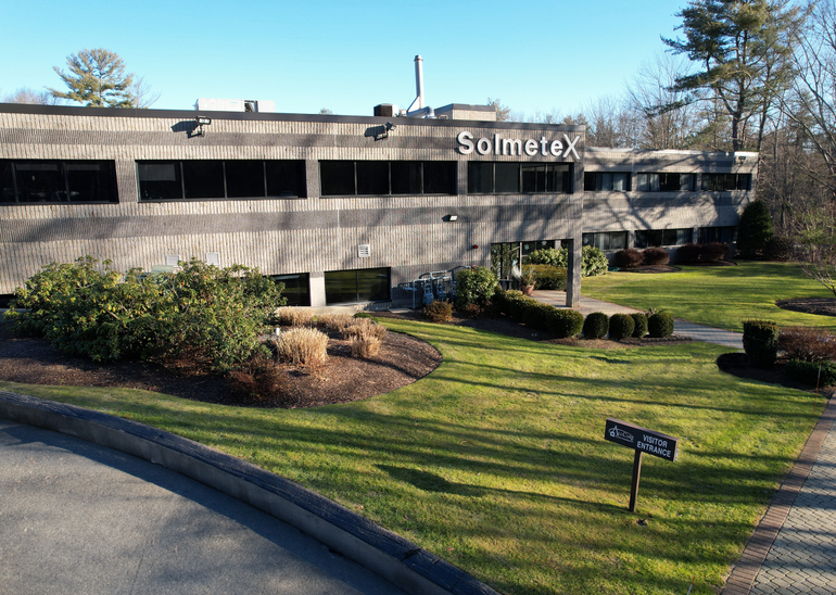 A two-story grey office building