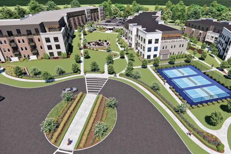 rendering of a large apartment complex with lawn space and pickleball courts. 