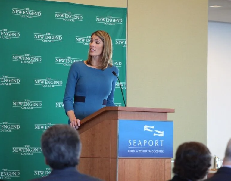 Woman speaks at podium