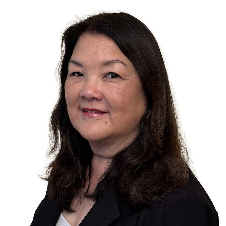 Woman posing for portrait photo in front of white background